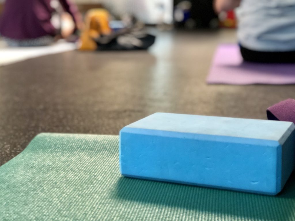 In yoga class - yoga mat and yoga block